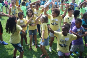 Pre-teens dancing at Garfield Playfield at summer day camp event